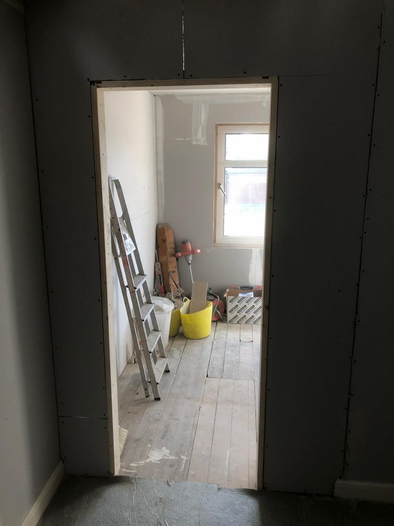 This is the stud wall which was added to create an extension of the bathroom entrance door