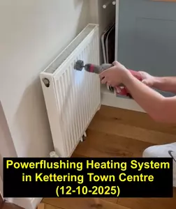 Image of Normz Plumbing team member using radiator vibrator tool for powerflush in Kettering Town Centre, job completed 12 October 2025
