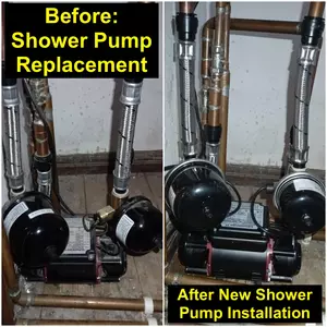 New twin impeller shower pump installed on bathroom floor with flexible hoses connected